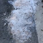 Road salt after winter storm. The salinization from winter road salt combined with other pollutants creates “chemical cocktails” that can jeopardize the ecological balance of waterways. Credit: Sujay Kaushal.